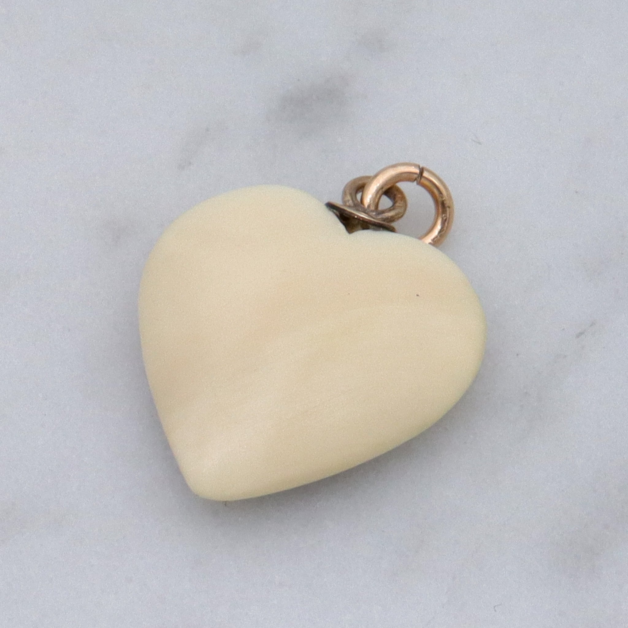 Antique hand carved faux ivory sailboat heart charm pendant
